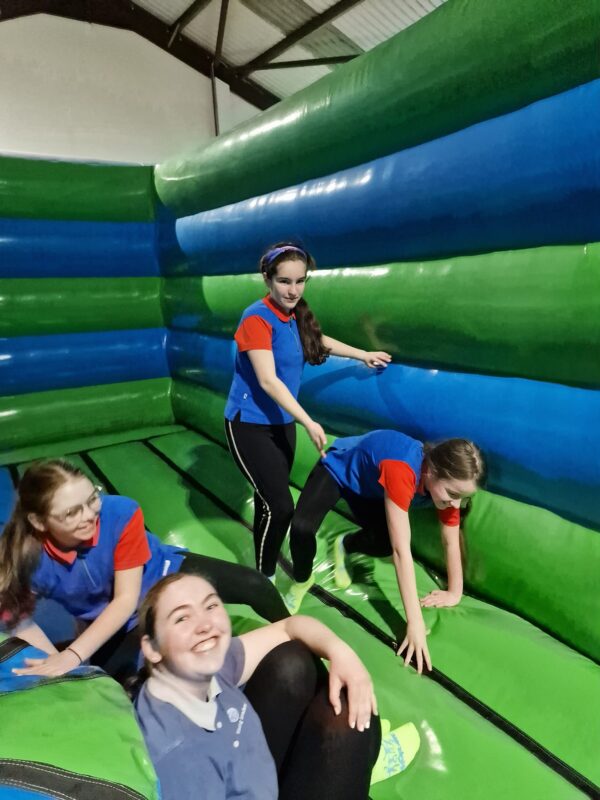 Girl Guides have fun on an inflatable