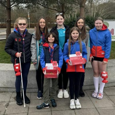 2nd Balloch guides and rangers assisting poppy Scotland selling poppies on Saturday