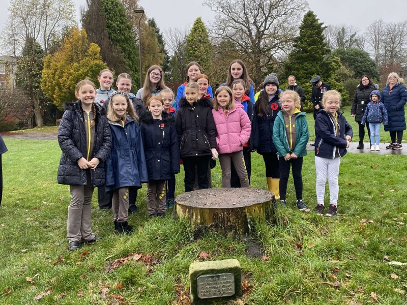 Helensburgh Girlguiding members stand around the stump of the Golden Jubilee tree