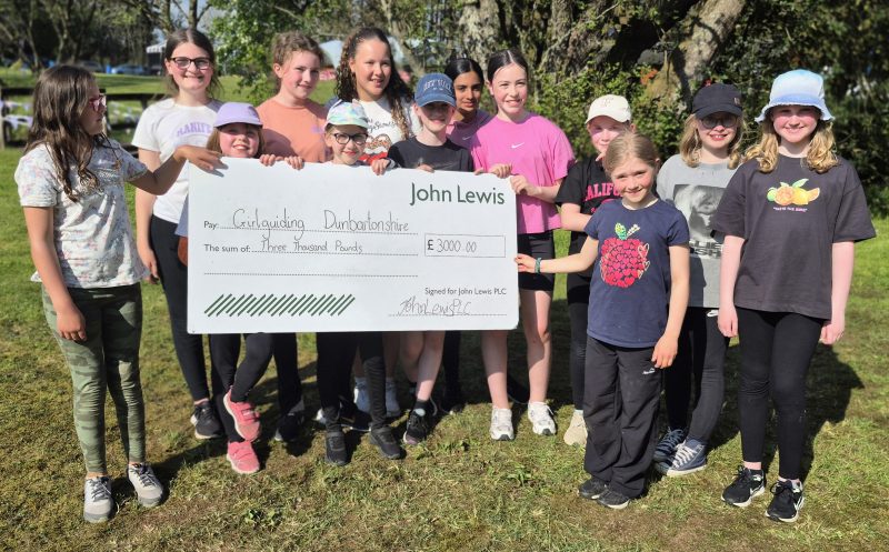 9th MIlngavie Guides with a giant John Lewis cheque